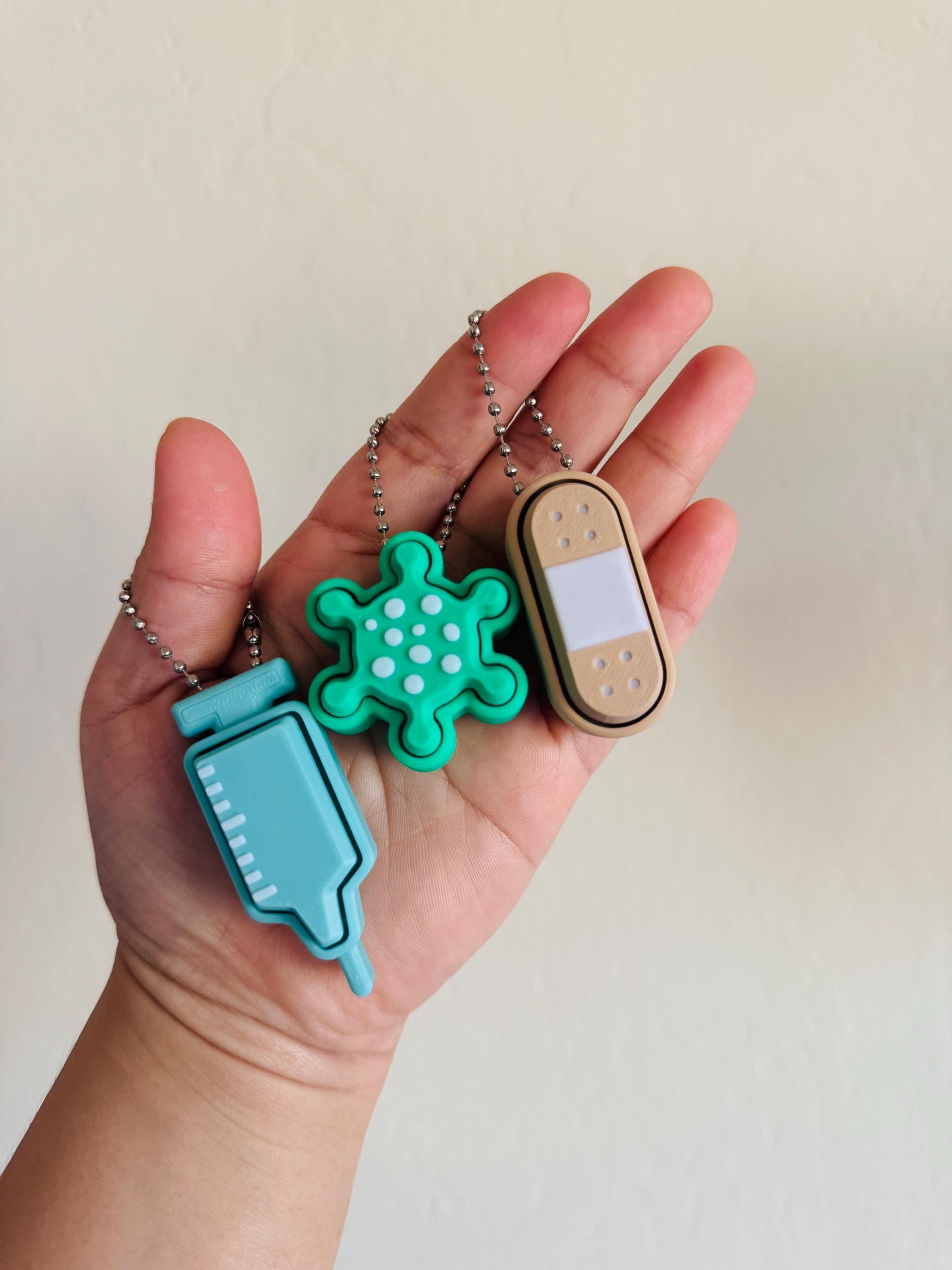 Care Clicker Keychain: Bandaid, Syringe, Virus Designs