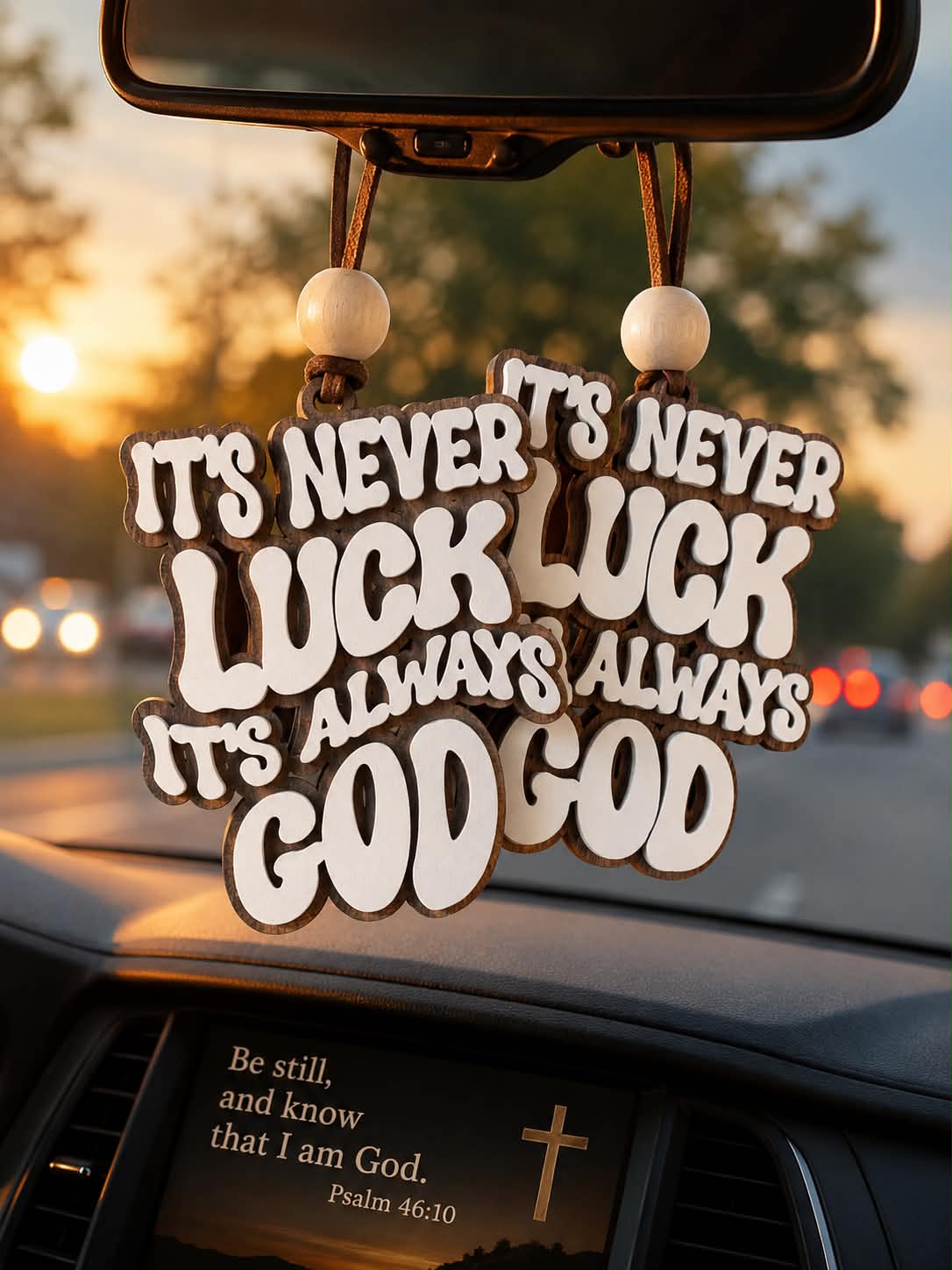 Laser engraved wood car charm with It's Never Luck It's Always God groovy retro quote hanging from rearview mirror