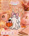 Kawaii ghost pen holder desk organizer with coquette pink bow and pumpkin basket holding pens on pink Halloween desk setup