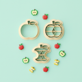 Apple clay cutter set with finished polymer clay apple charms on mint background