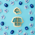 LA baseball cap and jersey clay cutter set with colorful finished polymer clay charms on blue background