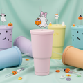 Ghost girl straw topper on tumbler cup with mint background
