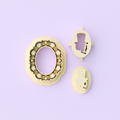 Sideways skull and cameo frame clay cutters on pastel purple background